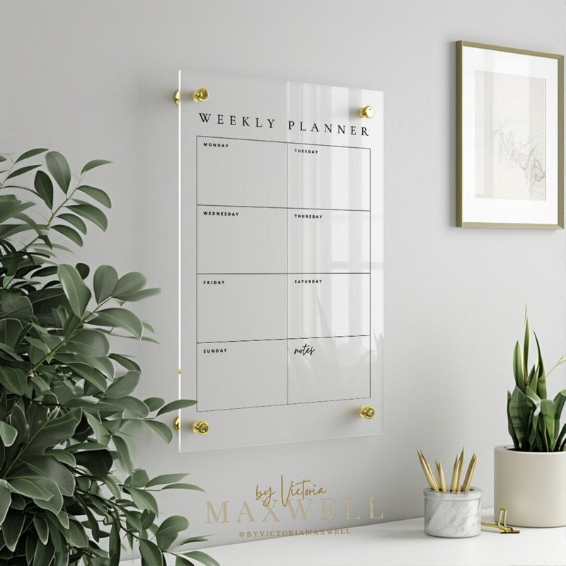Acrylic wall planner displayed within modern family kitchen