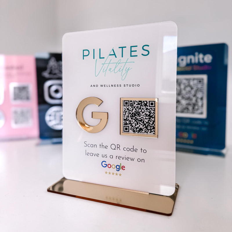 Google Review QR code sign displayed on salon reception desk