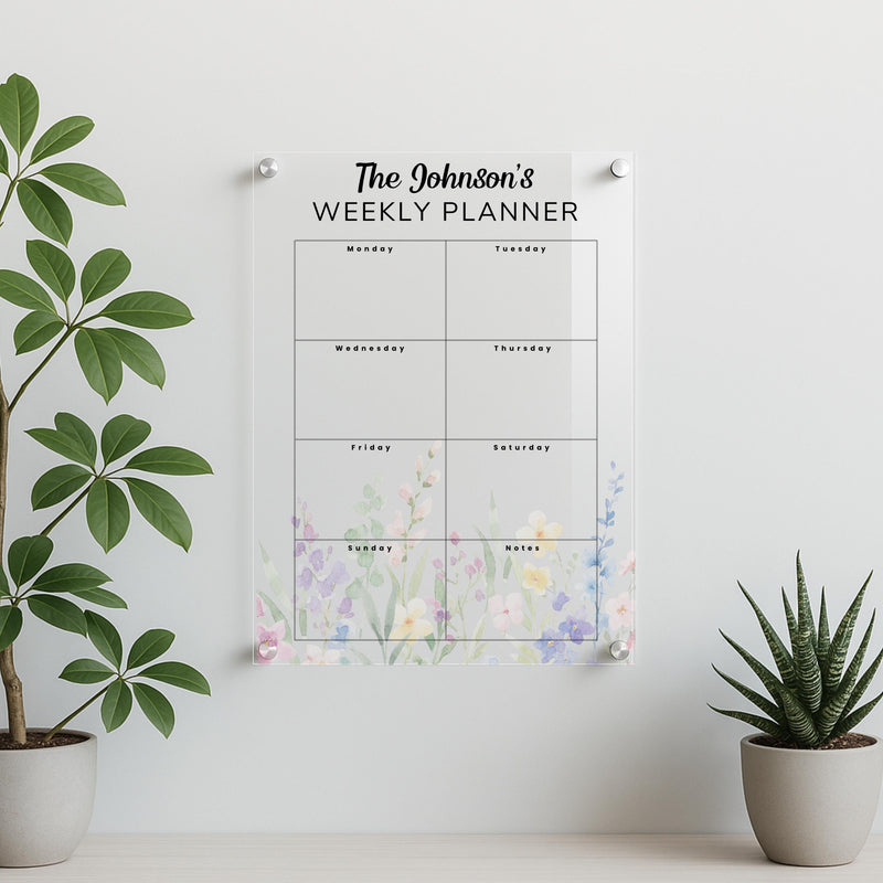 Personalised acrylic family planner mounted on wall