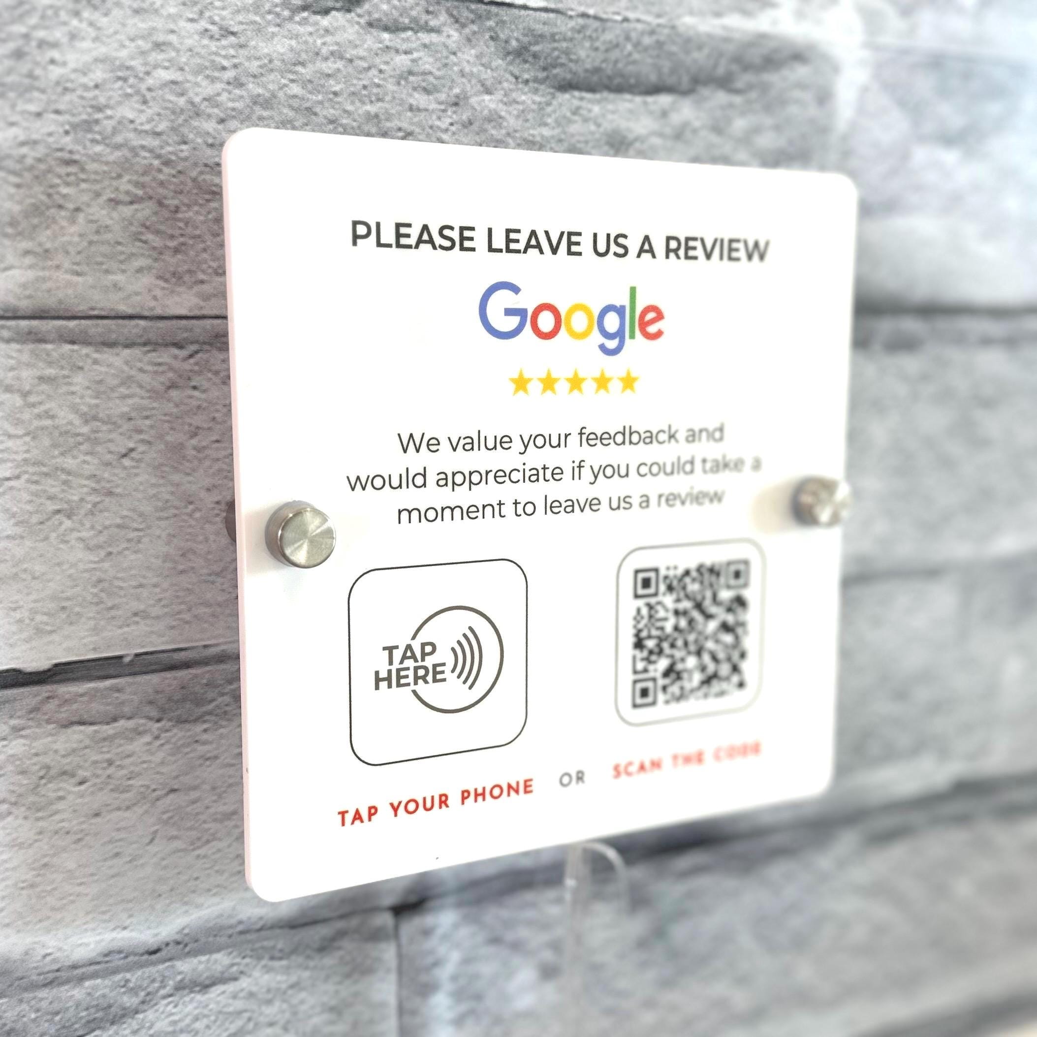 Wall-mounted acrylic Google Review sign with NFC tap and QR code. Features business logo, Google star rating, and 'Tap Your Phone' for easy customer reviews. Ideal for reception areas, salons, restaurants, and offices.