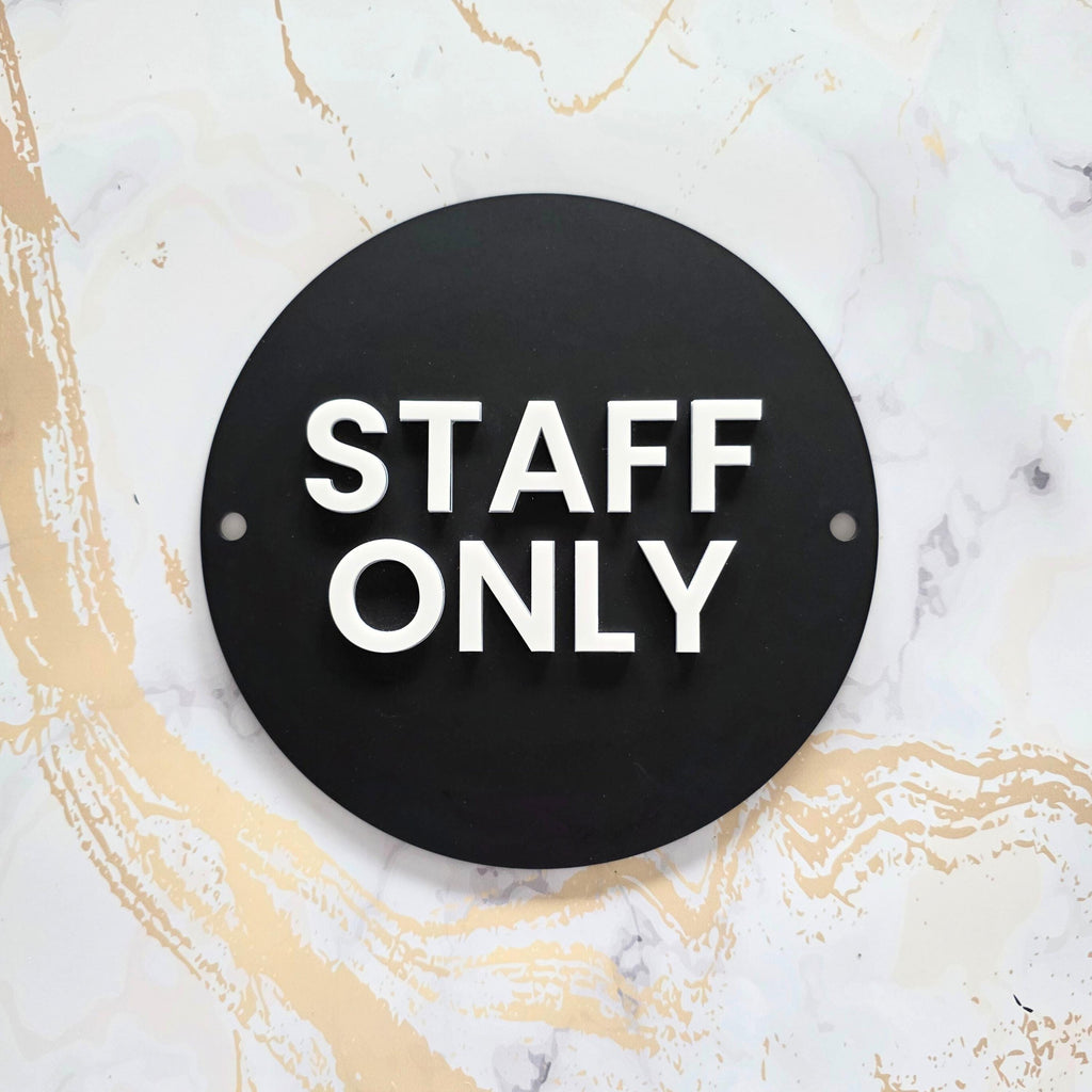 Wall-mounted matte black acrylic STAFF ONLY door sign with a modern white 3D acrylic lettering. Features silver standoff fixings for easy installation. Available in multiple colourways. Ideal for businesses, restaurants, offices, public washrooms