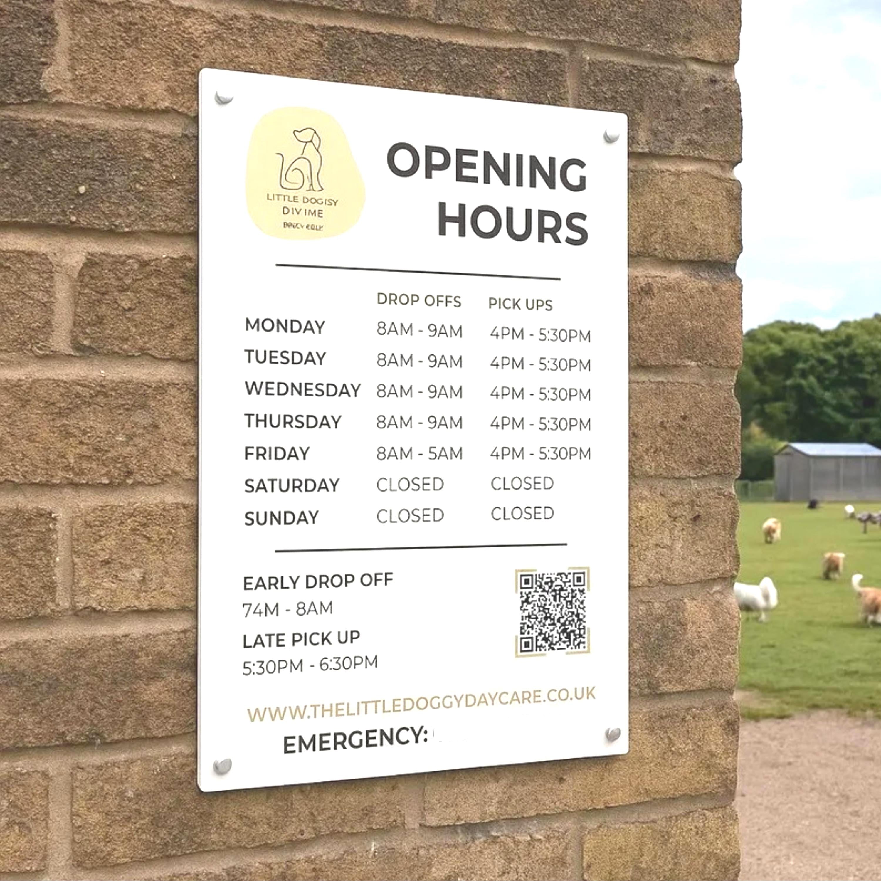 shop opening times and QR code printed on to a acrylic sign that is mounted to the wall using standoff fixings